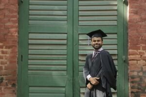Pakistani student in UK graduation gown